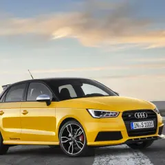 Żółty Audi RS1 z czarnym dachem i felgami, gotowy do jazdy po pustej drodze o zachodzie słońca.