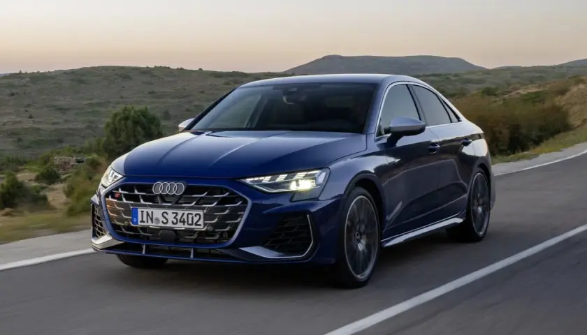 Niebieskie Audi A3 S Line na krętej drodze. Sprawdź aktualną audi a3 cena i wybierz swój wymarzony model.