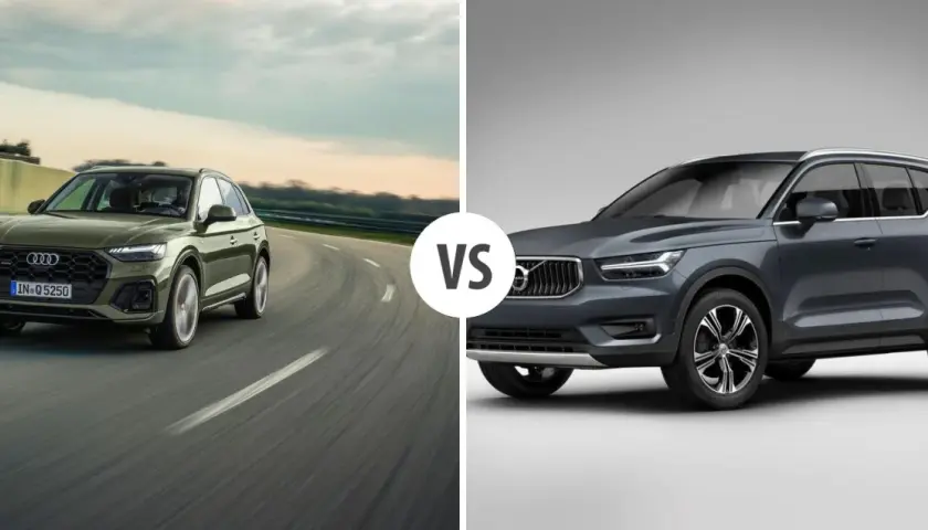 Zielony Audi Q5 na drodze, obok szarego Volvo. Porównanie audi q5 wymiary i możliwości.