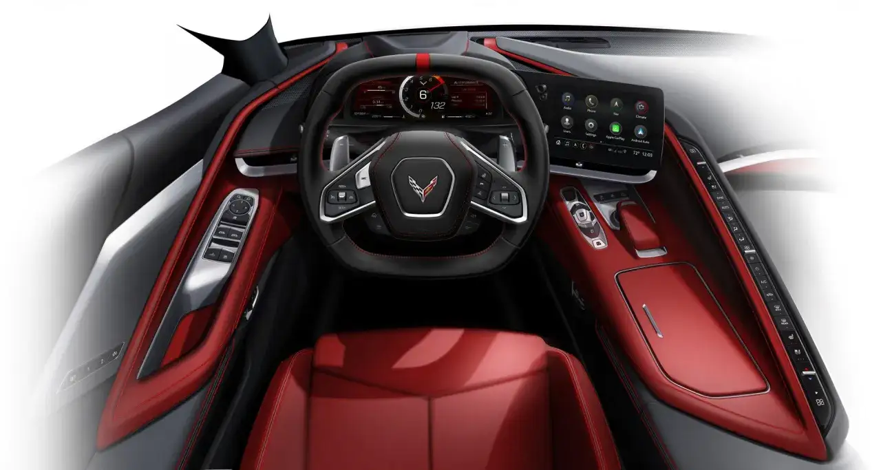 Wnętrze Chevrolet Corvette C8 z czerwonymi skórzanymi fotelami, cyfrowym kokpitem i ekranem dotykowym.