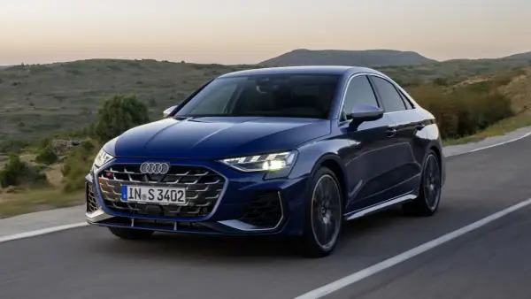 Niebieskie Audi A3 S Line na krętej drodze. Sprawdź aktualną audi a3 cena i wybierz swój wymarzony model.
